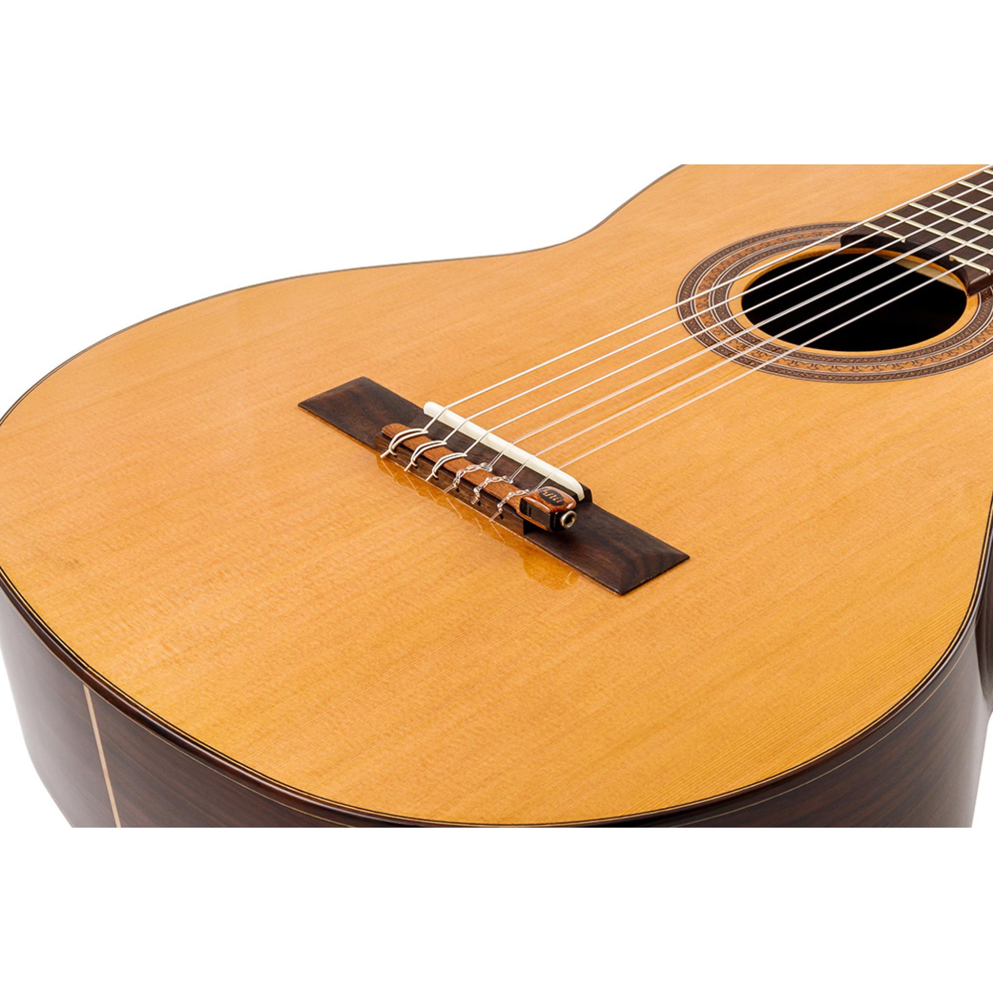 Portable bridgemounted piezo for nylonstring guitar